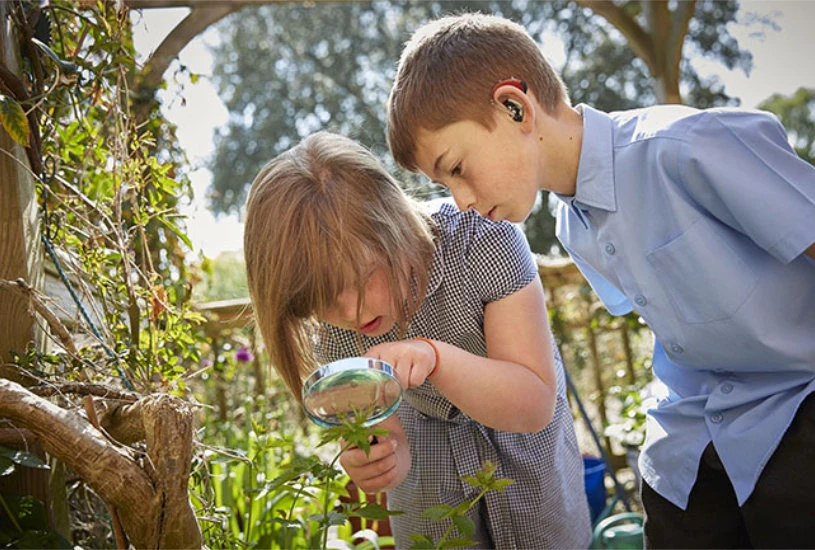 Kids taking a class outside