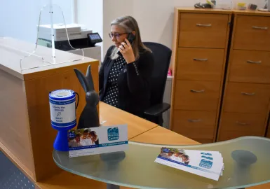 Woman at the photo in reception area